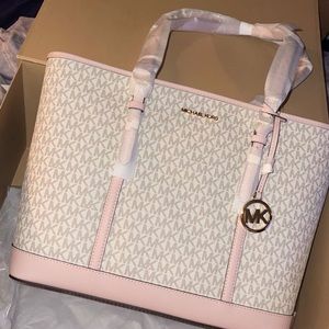 Michael Kors -used a few times now